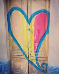 Close-up of heart shape made on wall