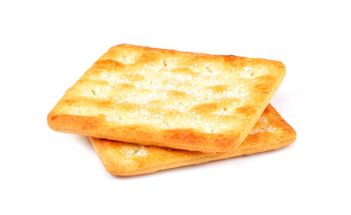 Close-up of bread on plate against white background