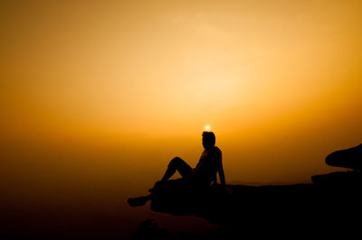 Silhouette person at sunset