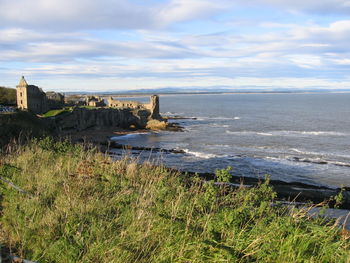 Scenic view of sea against cloudy sky