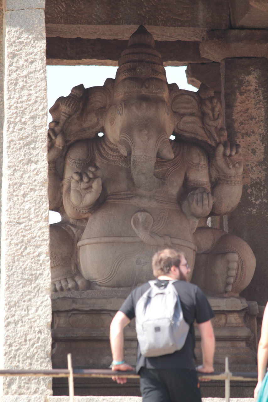 STATUE OF A WOMAN IN A BUILDING