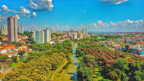 High angle view of trees and buildings against sky