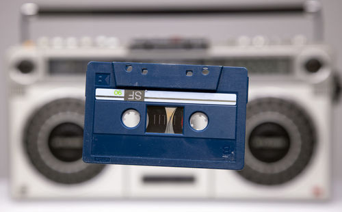Close-up of telephone booth on table