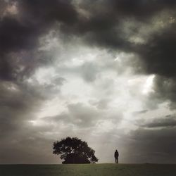 Scenic view of landscape against cloudy sky