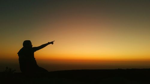 Silhouette of man at sunset