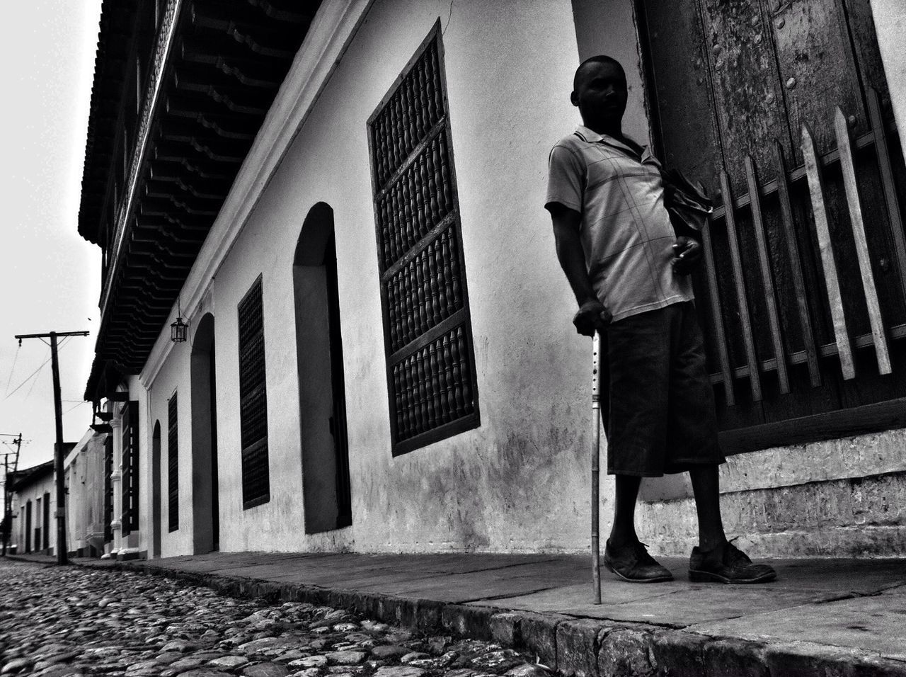 building exterior, architecture, built structure, low angle view, building, steps, city, men, full length, day, walking, outdoors, steps and staircases, lifestyles, standing, sky, rear view, residential building