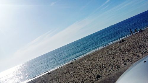 Scenic view of sea against blue sky