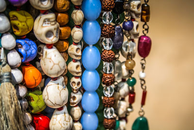 Close-up of multi colored jewelry for sale in market