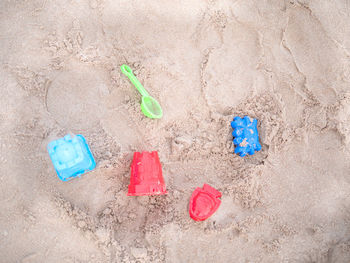 High angle view of toy on sand