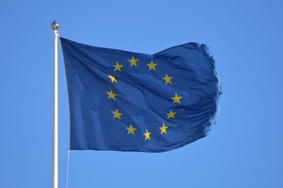 Low angle view of european flag against clear blue sky