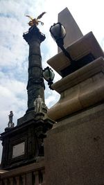 Low angle view of statue against sky