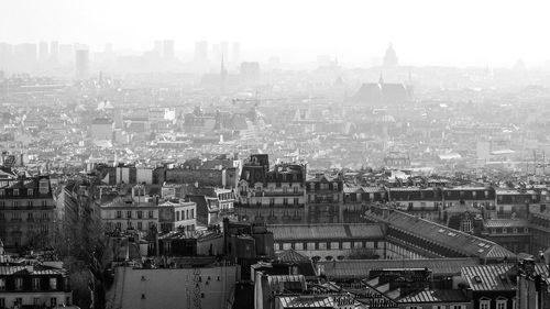 High angle view of buildings in city against sky