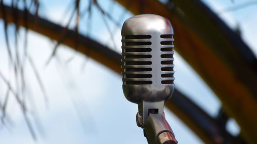Close-up of microphone against tree
