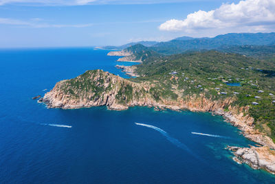 High angle view of sea shore against sky