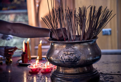 Midsection of person in temple against building