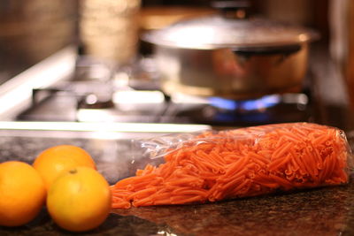 Close-up of orange fruits in kitchen