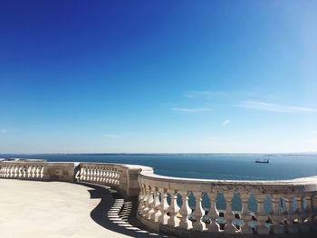 Scenic view of sea against blue sky