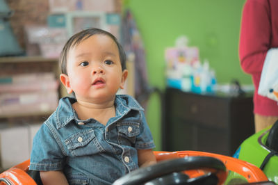 Portrait of cute boy looking away