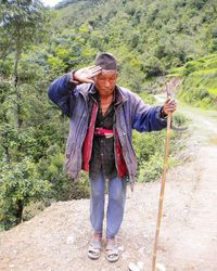 Full length portrait of young man standing outdoors