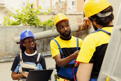 Side view of man working at construction site