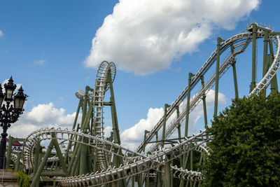 Low angle view of rollercoaster against sky