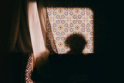 Close-up of curtain against window at home