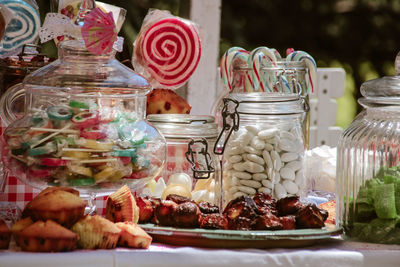 Close-up of candies in glass jar on table