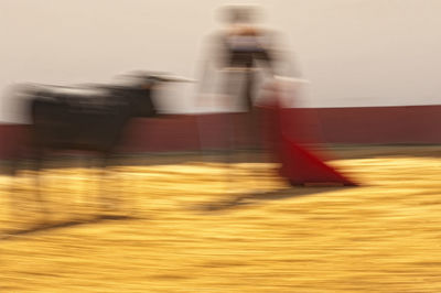 Blurred motion of people on road