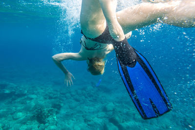 Woman swimming in sea