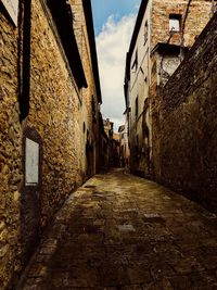 Narrow alley amidst buildings