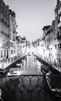 Canal passing through city buildings