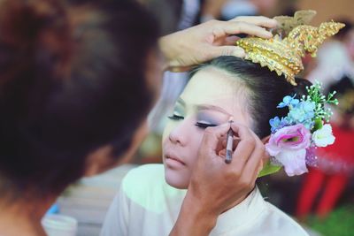 Artist applying make-up with brush