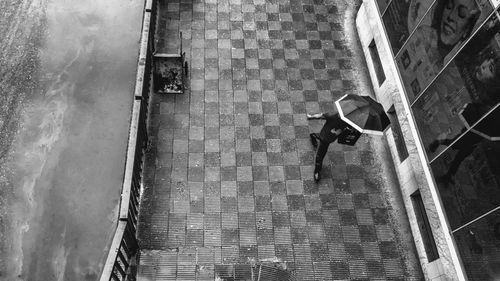 High angle view of people walking on footpath