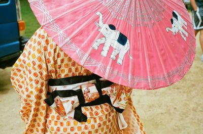 Close-up of person under umbrella