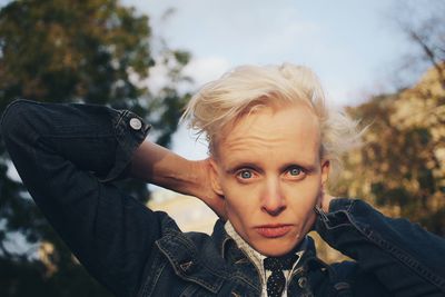 Portrait of woman against trees