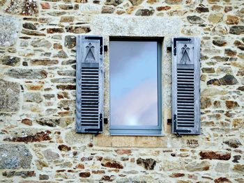 Low angle view of window on old building