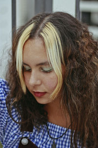 Close-up of a beautiful young woman with highlights