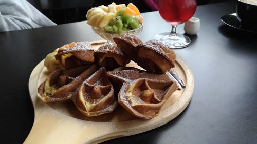 Close-up of waffles in plate on table