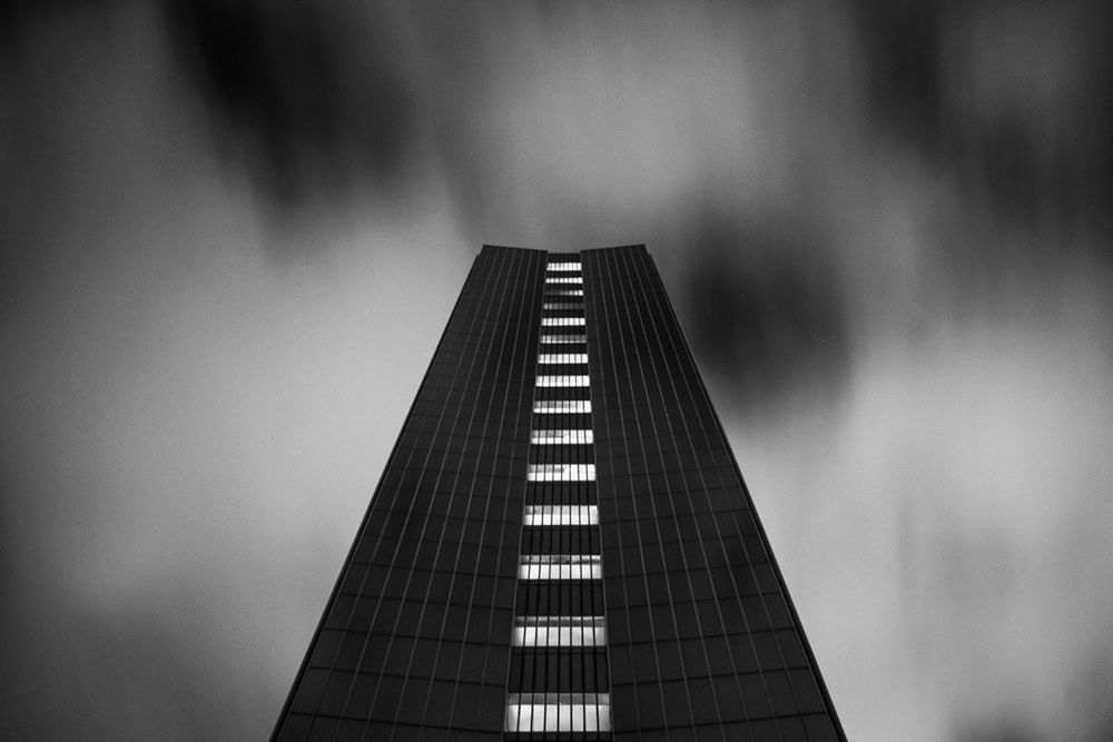 architecture, building exterior, built structure, low angle view, city, skyscraper, tall - high, sky, modern, office building, building, tower, outdoors, no people, day, tall, dusk, weather, cloud - sky, overcast