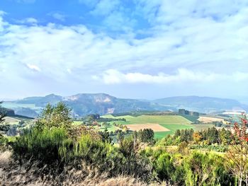 Scenic view of landscape and mountains against sky