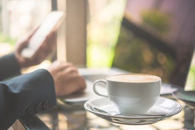 Coffee cup on table at cafe