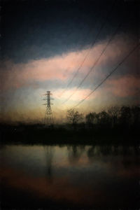 Electricity pylon against sky during sunset