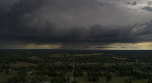 Scenic view of landscape against cloudy sky