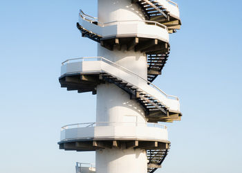 Low angle view of tower against clear blue sky