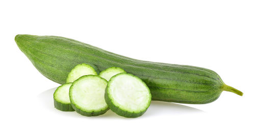 Close-up of green pepper against white background