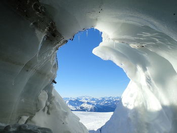 Close-up of snow capped mountain against clear sky