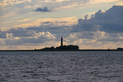 Silhouette of a lighthouse behind the baltic sea,