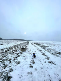 Scenic view of sea against sky during winter