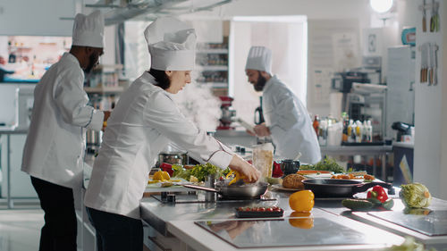 Chefs working in kitchen