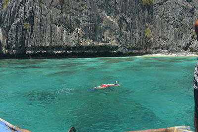 Person swimming in sea